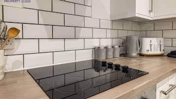 Fridge, microwave, highchair, cookware/dishes/utensils