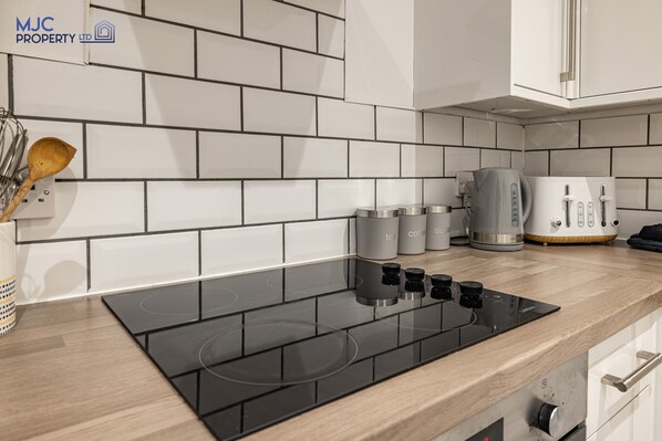 Fridge, microwave, highchair, cookware/dishes/utensils