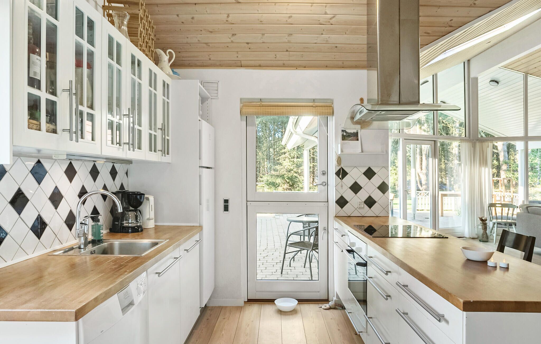 Fridge, stovetop, dishwasher, coffee/tea maker