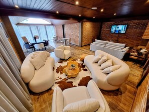 48-inch LCD TV with cable channels, pay movies