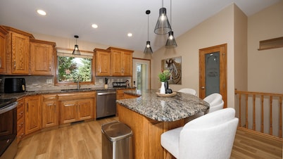 4-bedroom townhome in a quiet, upscale neighborhood with a private deck and yard