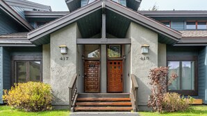 A modern house with a symmetrical facade, two doors labeled 417 and 416, and a small porch with steps. - 3 Bedrooms + Loft townhome in Snowcreek Phase 3,  Private Pool Table Sleeps 6 Guests, Dog Friendly (Mammoth Lakes)
