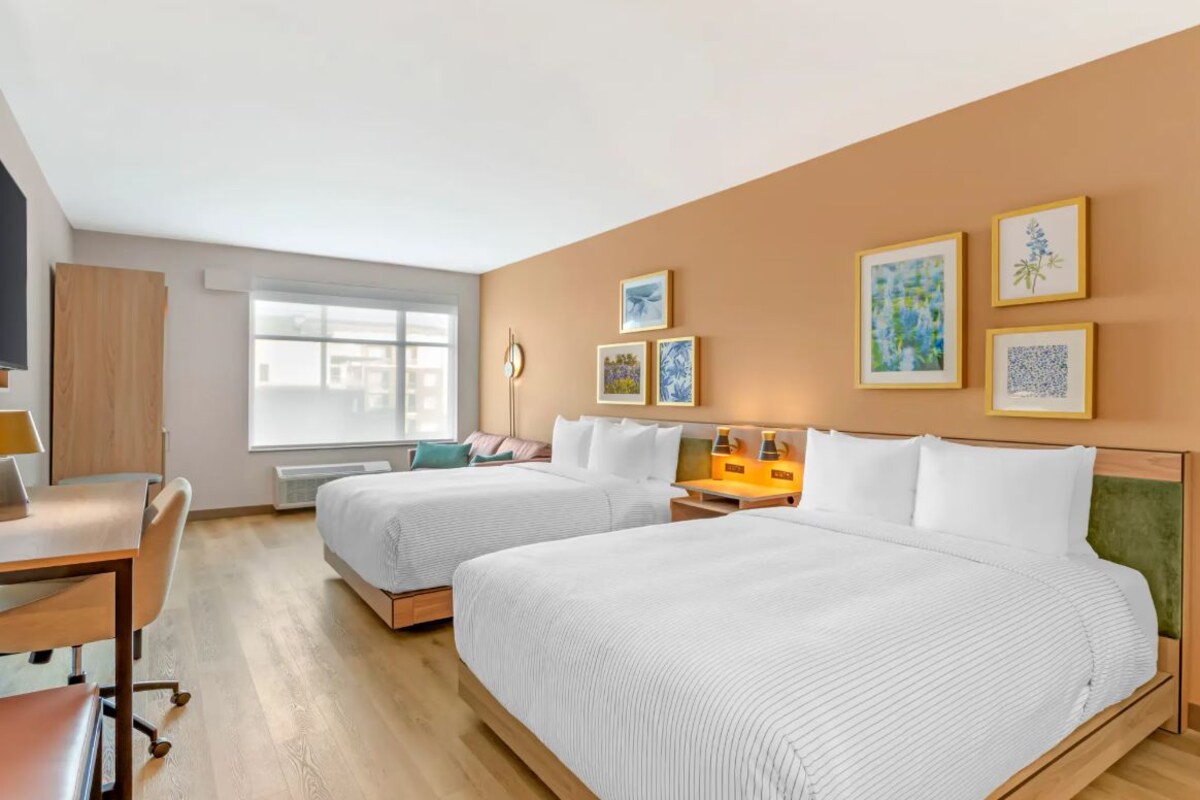 Premium bedding, memory-foam beds, desk, laptop workspace