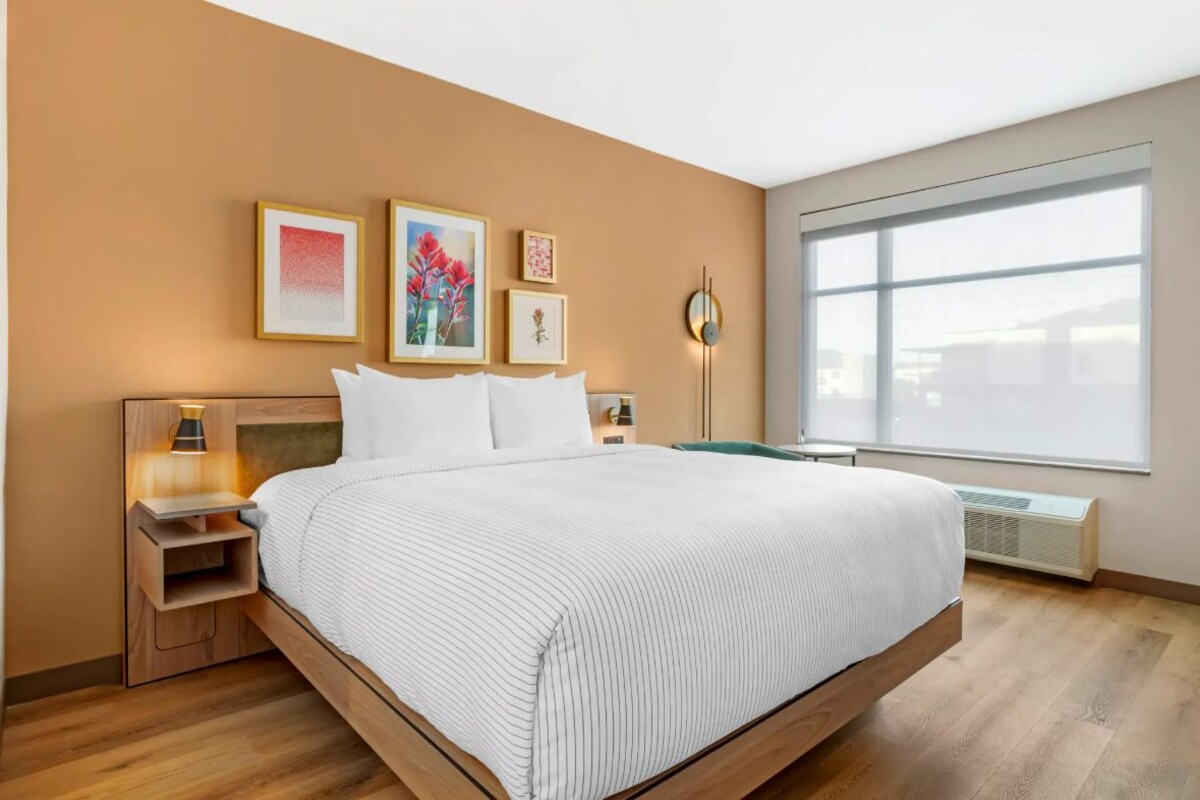 Premium bedding, memory-foam beds, desk, laptop workspace