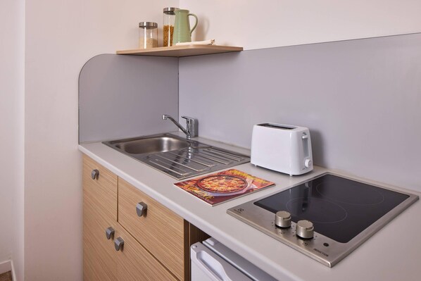 Mini-fridge, microwave, stovetop, coffee/tea maker