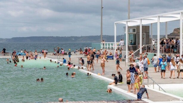 A crowded outdoor swimming pool with people enjoying the water and sunbathing. - The Jitterbug - Sleeping 4 Guests (The Hill)