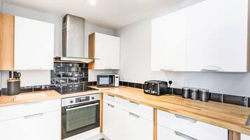 Fridge, oven, cookware/dishes/utensils