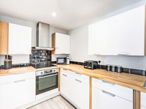 Fridge, oven, cookware/dishes/utensils