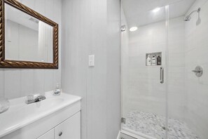 Shower, hair dryer, towels, shampoo