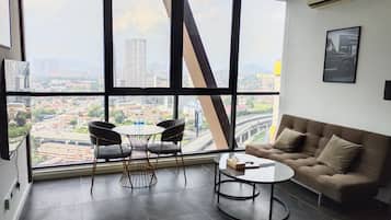 Family Apartment, 1 Bedroom, City View | Living area | 42-inch LED TV with digital channels