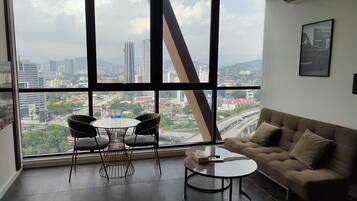 Family Apartment, 1 Bedroom, City View | Living area | 42-inch LED TV with digital channels