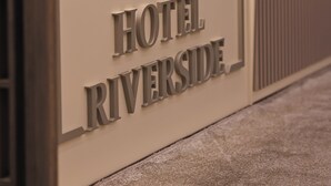 A hotel sign with the name "HOTEL RIVERSIDE". - Hotel Riverside (Skopje)