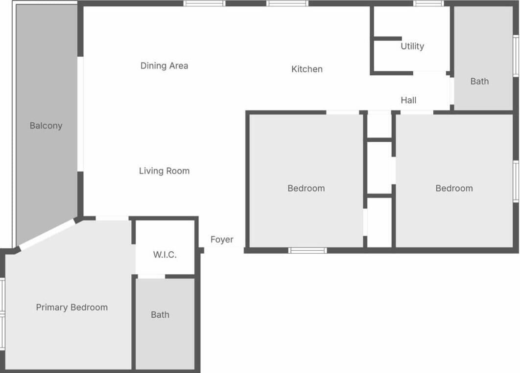Plano de planta que muestra un balcón, comedor, cocina, cuarto de servicio, baño, sala de estar, dos dormitorios, vestíbulo y armario de doble entrada.