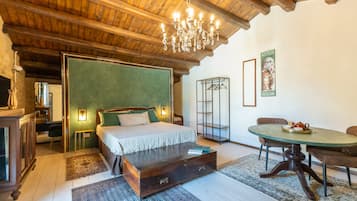 Junior Suite, Garden View | Minibar, in-room safe, soundproofing, free WiFi