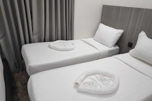 Coffres-forts dans les chambres, draps fournis