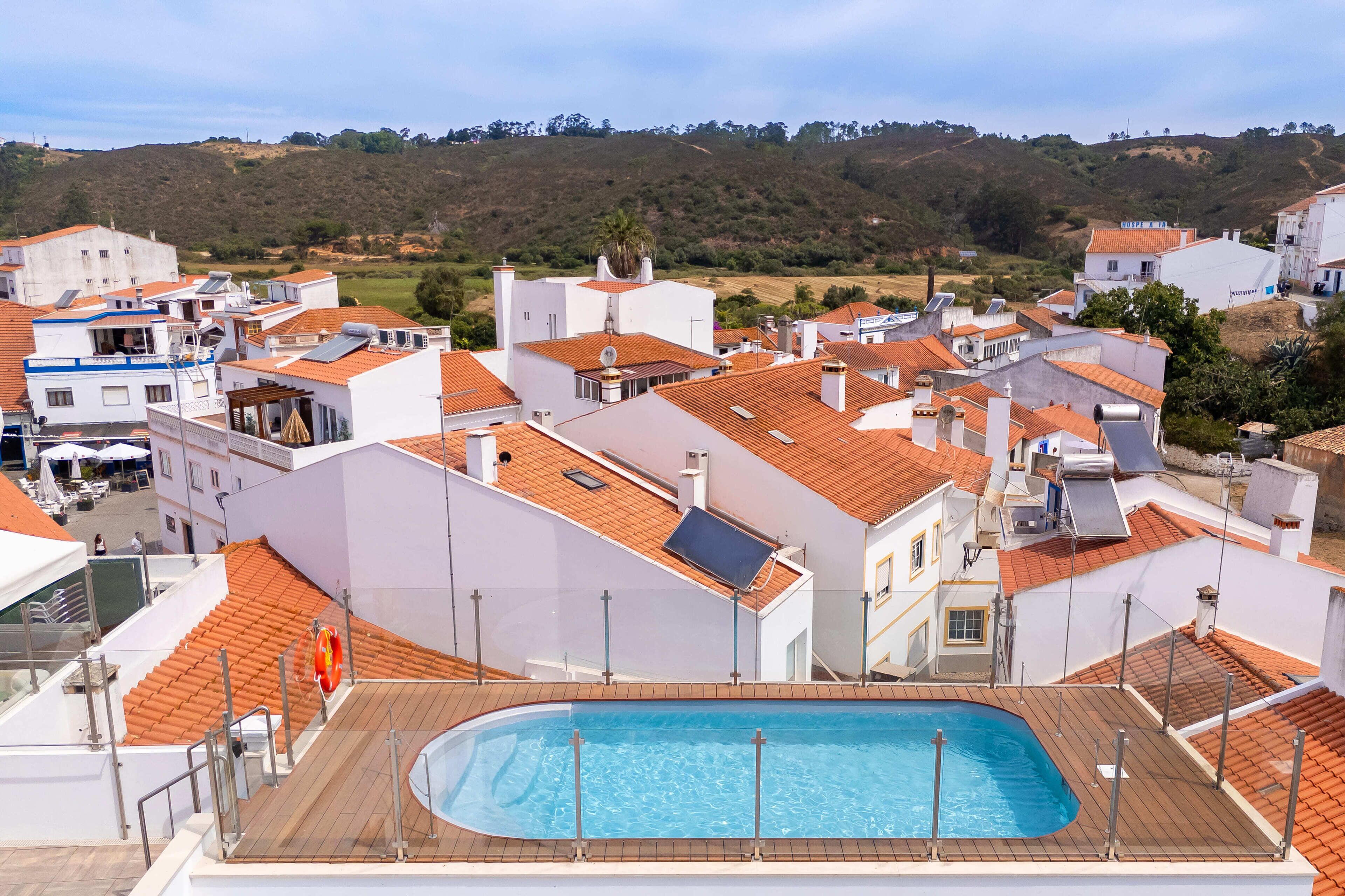 Outdoor pool, open 8:00 AM to 8:00 PM, pool umbrellas, pool loungers