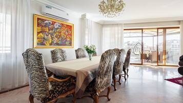 Apartment, 3 Bedrooms, City View | Living area | 50-inch flat-screen TV with cable channels