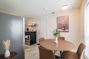 Dining - Enjoy two separate, fully furnished homes on one property — perfect for large groups. The front one-story home offers 3 bedrooms and 1 bath, while the back two-story home features 3 bedrooms, 2 baths, and an upstairs family room with 2 beds (Houston)