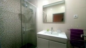 Shower, towels, soap, toilet paper