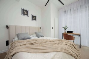 1 bedroom, desk, iron/ironing board, travel crib