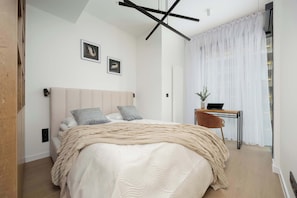 1 bedroom, desk, iron/ironing board, travel crib
