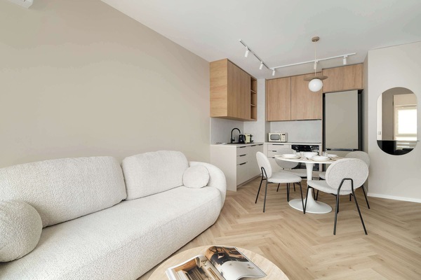 Relax in the stylish living room with a comfortable sofa and modern decor.