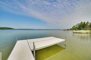 A calm lake with a wooden dock extending into the water. - Indian River Fall Escape: Fire Pit & Lake Views (Indian River)