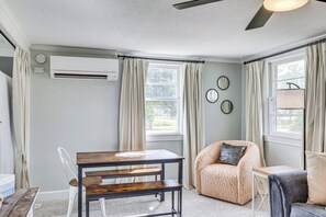 A room with a dining table, two chairs, a sofa, and a ceiling fan. - 7 Mi to Beach & Ocean! Morehead City Home (Morehead City)