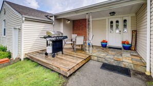 A house with a covered porch, a barbecue grill, and a brick wall. - Cozy Home w/ Spacious Yard: 2 Mi to Dtwn Bristol (Bristol)