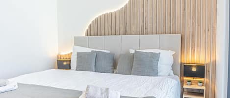 2 habitaciones, tabla de planchar con plancha y ropa de cama
