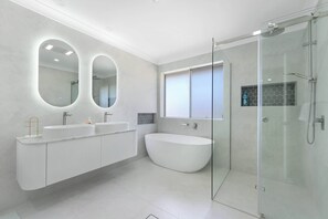 Shower, hair dryer, towels, shampoo