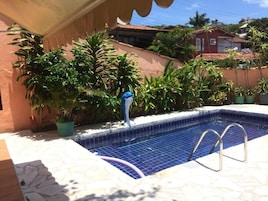 Outdoor pool, open 9:00 AM to 10:00 PM, pool umbrellas