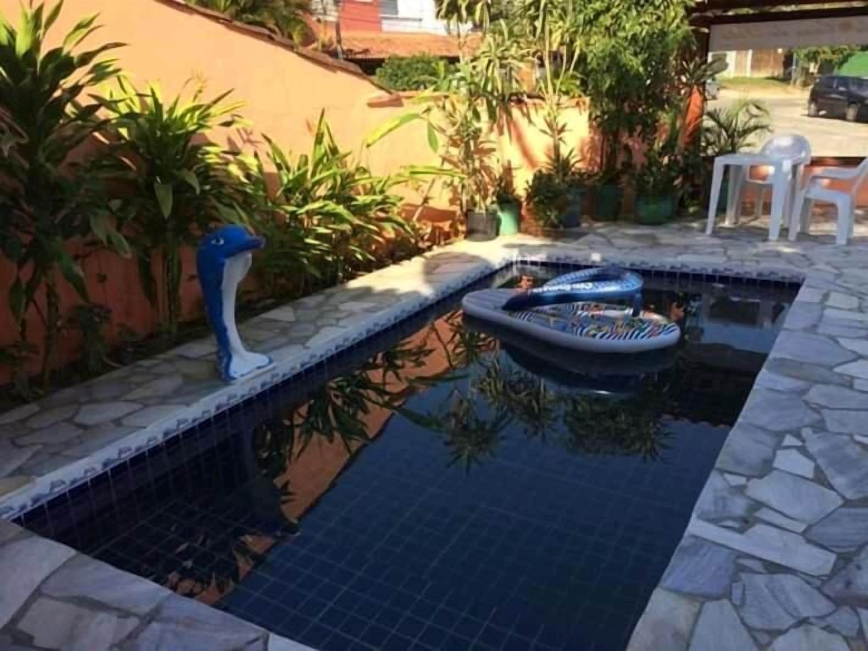 Outdoor pool, open 9:00 AM to 10:00 PM, pool umbrellas