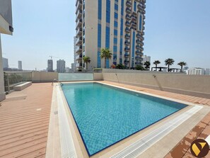 Outdoor pool - JVC near Circle Mall with full Amenities (Dubai)