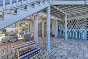 Outdoor dining - Five Bedroom Home with a Private Pool on the Channel and Pet Friendly (Garden City Beach)