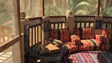 Deluxe Room, Garden View | Terrace/patio