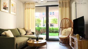 Departamento superior, vista al jardín | Sala de estar