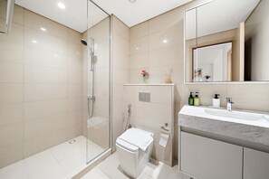 Shower, hair dryer, towels, soap