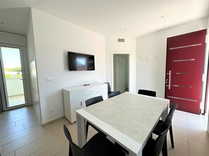 Apartment, 3 Bedrooms, Balcony | Dining room - Great and Bright Flat With Pool (San Michele al Tagliamento)