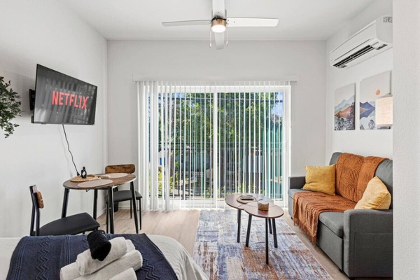 Relax in a bright and welcoming living space with comfortable seating, fast WiFi and a Smart TV after a day exploring the city.