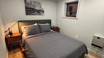 1 bedroom, desk, iron/ironing board, travel crib