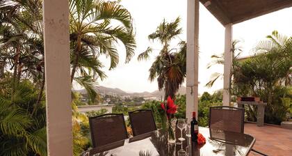 Charming 2-bedroom Tropical Cottage with Sunset Views and AC