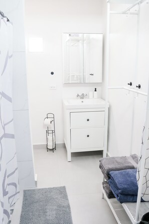 Hair dryer, towels, soap, shampoo