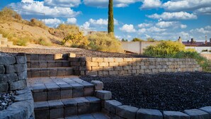 A stone staircase leading up to a building with a view of a tall tree and a clear sky. - Palisades hills home with City Mountain View’s  (Albuquerque)