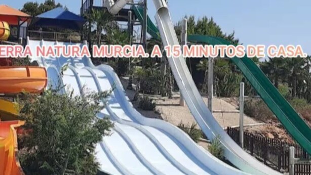 A water park with multiple slides and a pool. - Luxury penthouse with swimming pool, jacuzzi and gym near the spa of archena (MC)