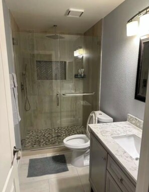 Shower, hair dryer, towels, soap