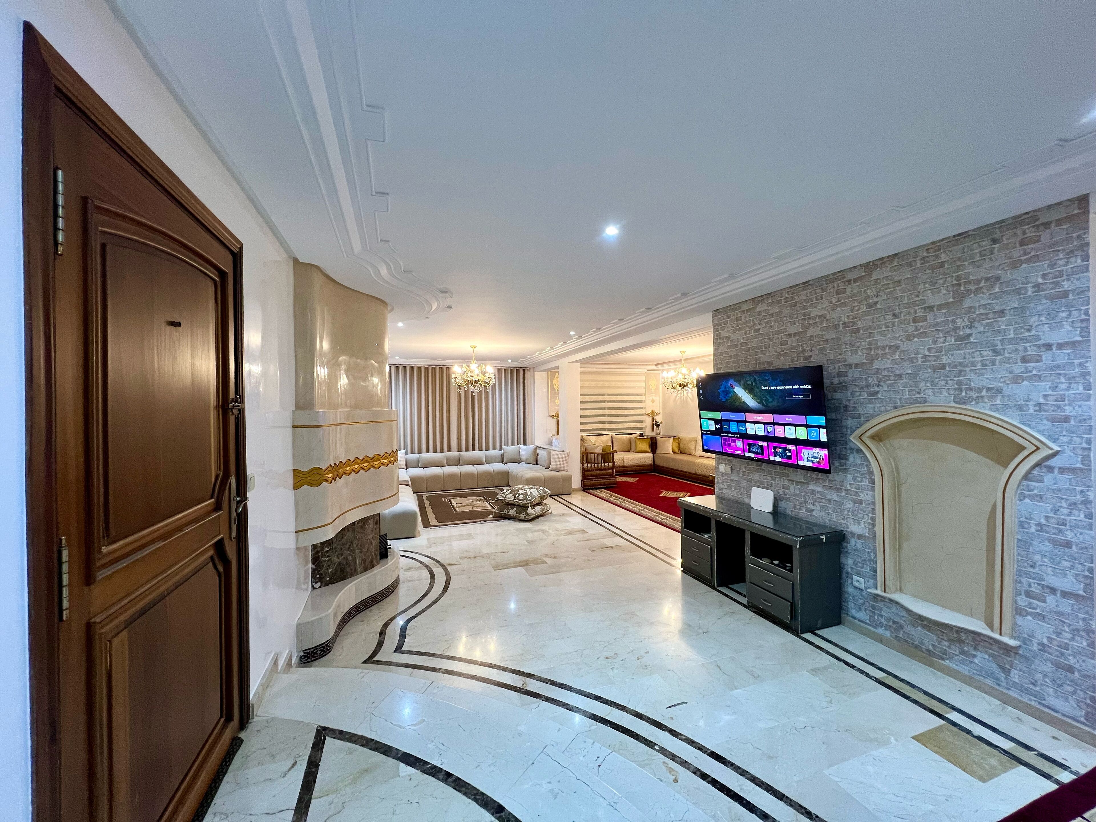 Deluxe Apartment, Balcony, City View | Living area | 150-cm Smart TV with satellite channels