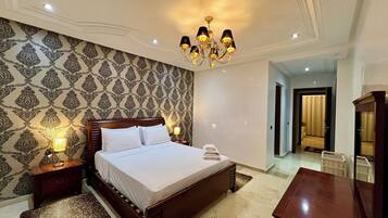 Deluxe Apartment, Balcony, City View | In-room safe, blackout drapes, soundproofing, iron/ironing board