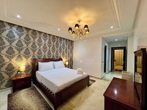 Deluxe Apartment, Balcony, City View | In-room safe, blackout drapes, soundproofing, iron/ironing board