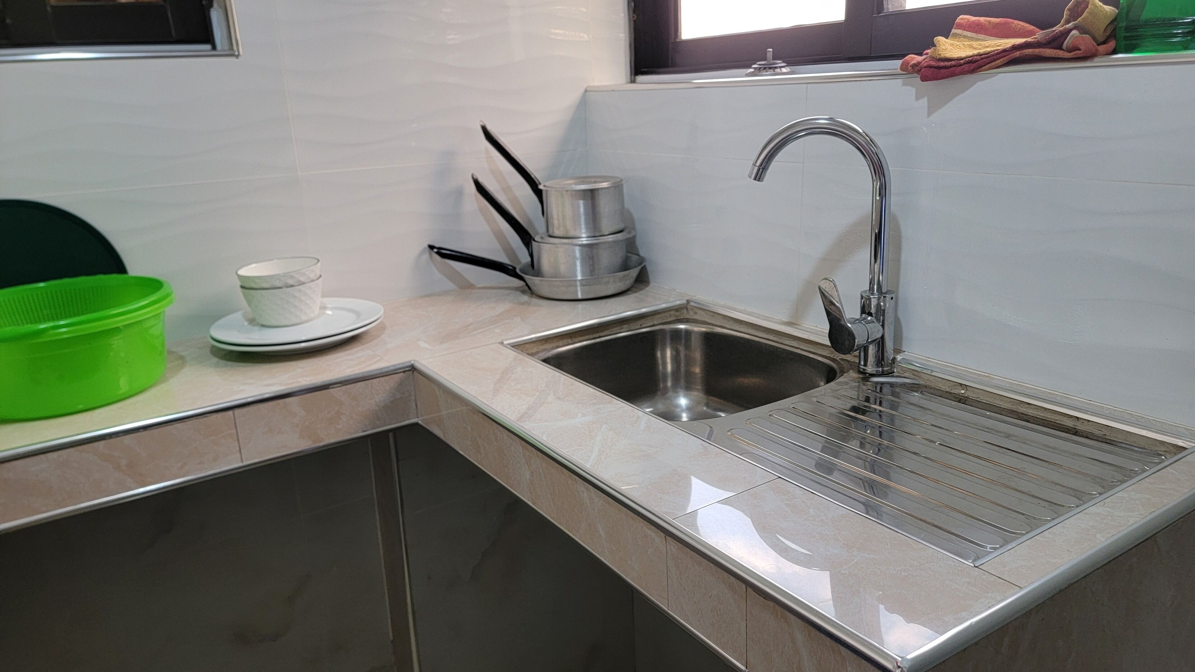 Mini-fridge, microwave, electric kettle, cleaning supplies